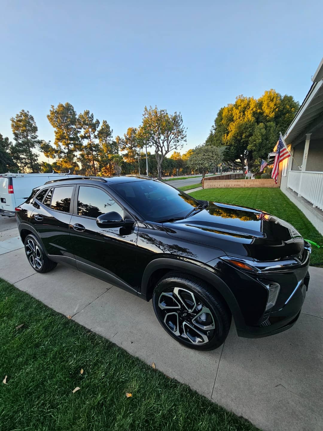 Glossy black Chevrolet SUV parked on a driveway